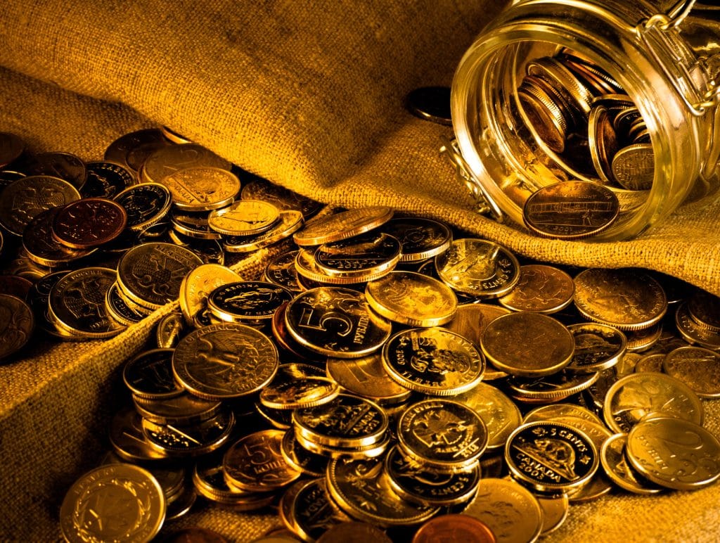 Golden coins. Russian currency. Roubles. Money. Money in a jar