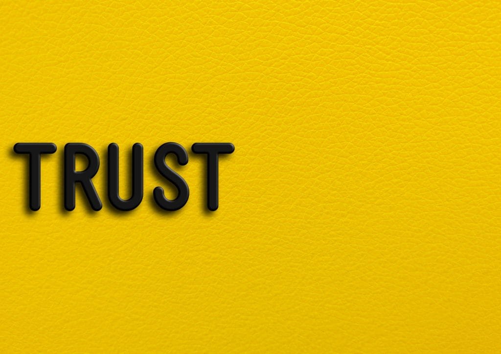 “Trust” on yellow leather background