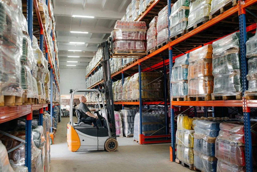 Warehouse man worker with forklift.